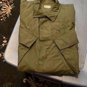 NWOT- Olive Green dark. Over flap to cover buttons. Campaign Pockets on Front